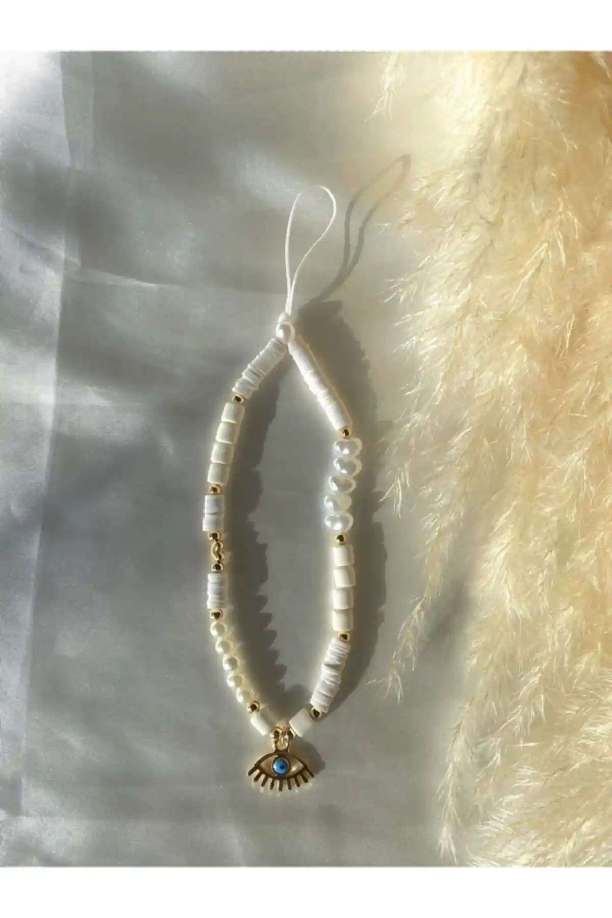 Moshi Design Telefon Askısı ve Charmı: Şık ve Kullanışlı Telefon Aksesuarları